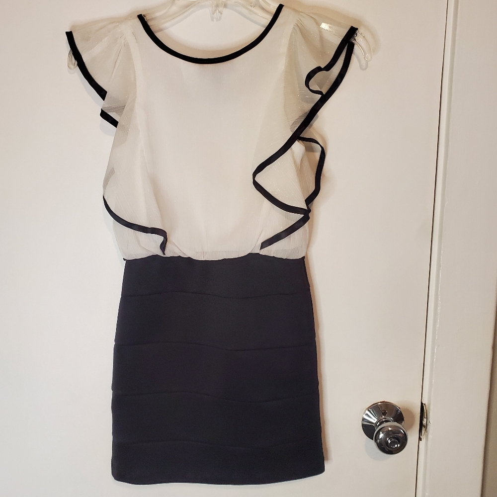 This is a great party or special event dress iZ black and white dress size 7.